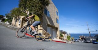 Rider climbing steep hill on Sausalito 2, Sausalito, CA.