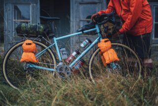 Marin Four Corners 1 profile, showing bike loaded with bags and bottles.