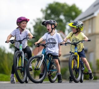 Kids aboard their Coast Trail bikes.